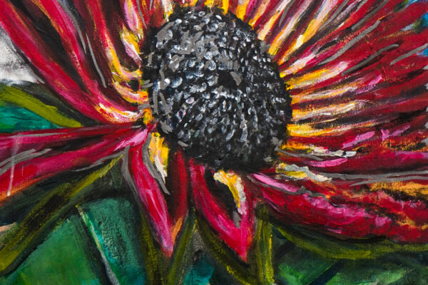 The late red sunflower lights up the earth as other organic colors fade.